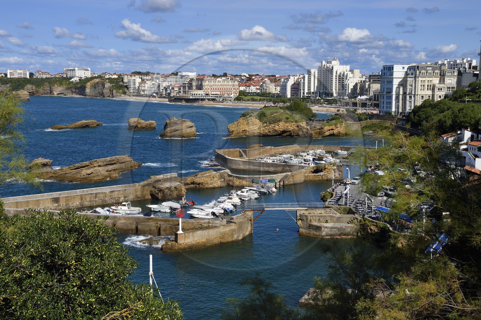 France, Pyrenees Atlantiques, Basque Country, Biarritz, Port des Pecheurs, Sainte Eugenie church and facades of the buildings located on Grande Plage (Great beach)