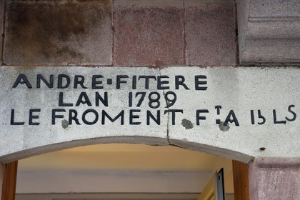 France, Pyrenees Atlantiques, Basque Country, Saint Jean Pied de Port, 9 rue d'Espagne (Spain street) on the Way of St. James, lintel that reflects the anger of the baker André Fitere who complained in 1789 of the too high price of wheat at 15 pounds