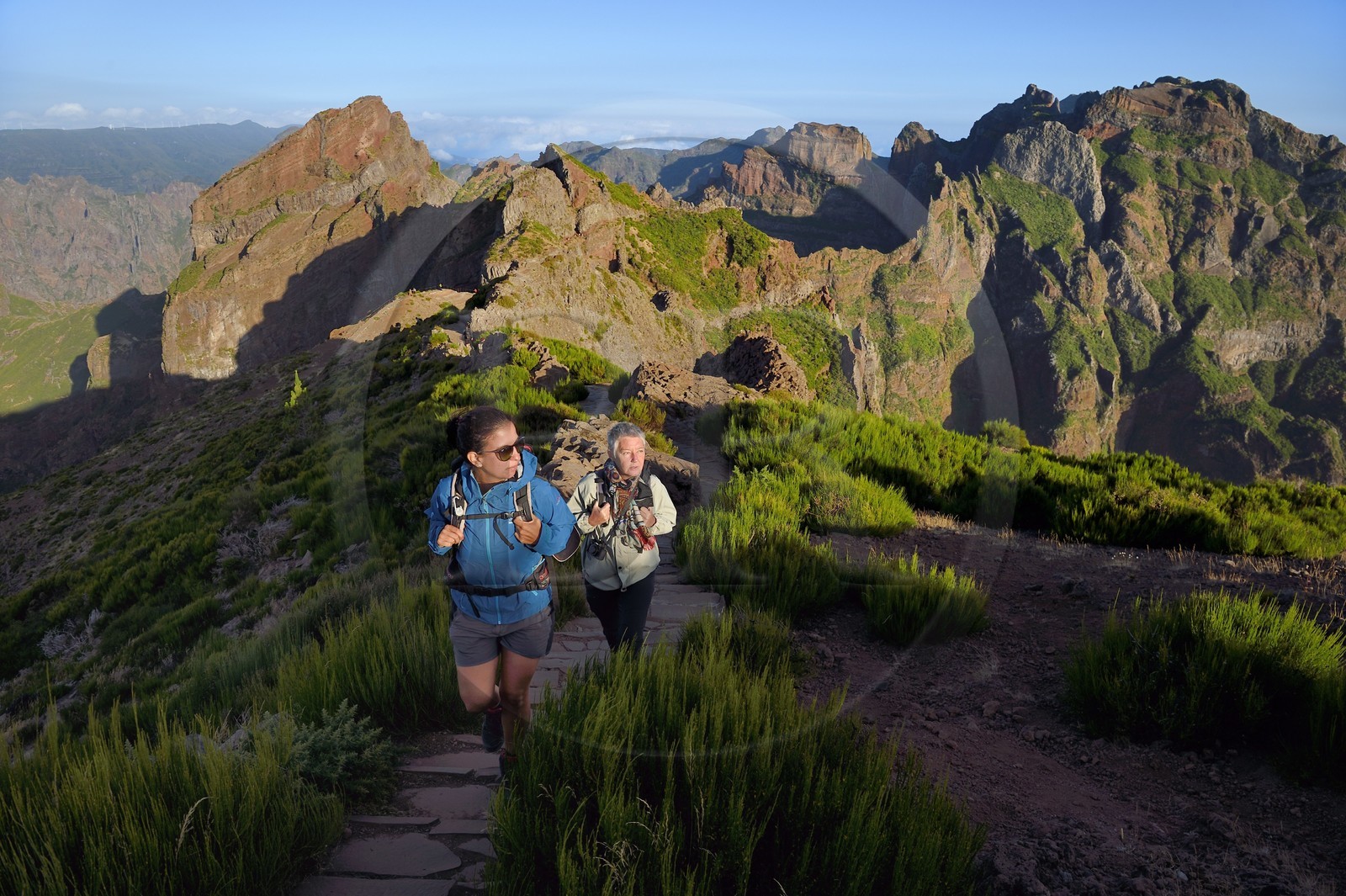 Portugal, Madeira Island, hikers on the Vereda do Areeiro hike between Pico Ruivo (1862m) and Pico Arieiro (1817m), view from Pico Arieiro over the central mountain range