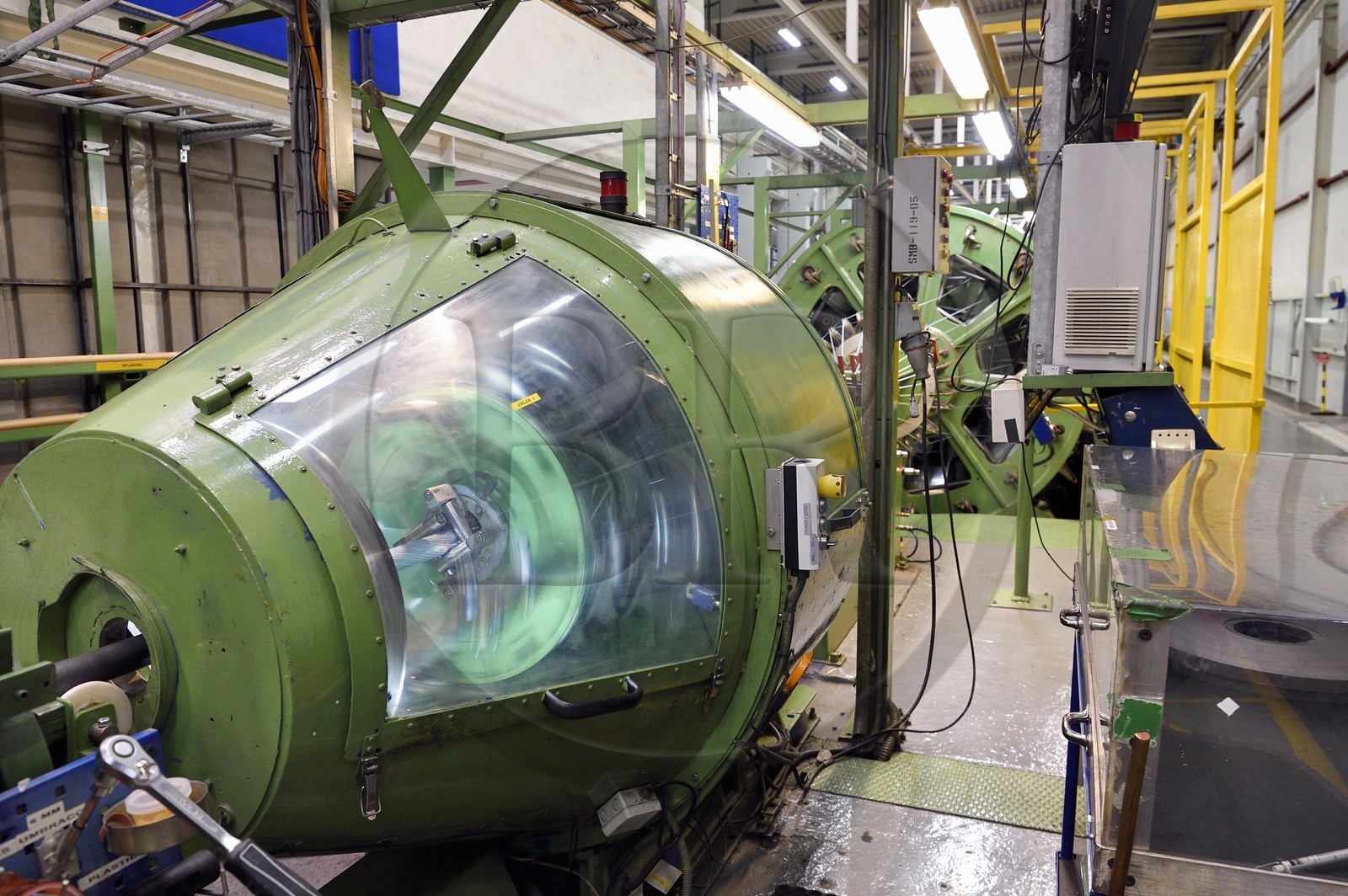 Norway, Ostfold County, Halden, Nexans cable manufacturing plant, braiding of aluminum conductors