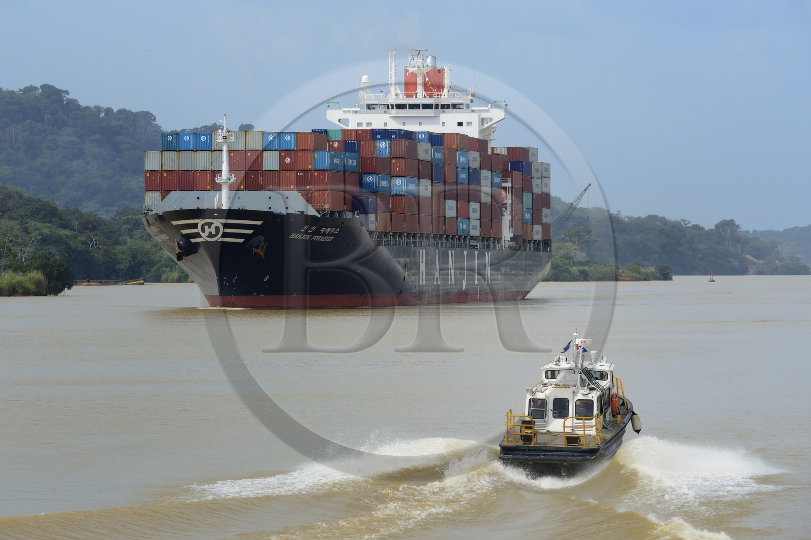 Panama, Panama Canal at Gamboa, Korean Panamax container cargo and pilote boat